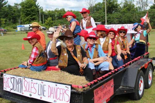 The ABC Stompin Soles Line Dancers shared the best float award with Gord Patterson’s 1949 Model M John Deere tractor hauling antique items. The Green Party (the only other entry) came third. Photo/Craig Bakay